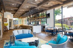 a restaurant with blue couches and tables and a bar at Margaritaville Island Hotel in Pigeon Forge