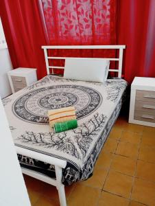 a bedroom with a bed with a laptop on it at Flamingo Vila Alicante in San Pedro del Pinatar