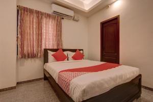 Ένα ή περισσότερα κρεβάτια σε δωμάτιο στο Hotel O Blue Moon