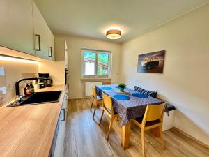 a kitchen and dining room with a table and chairs at Berghof Werfenweng in Werfenweng