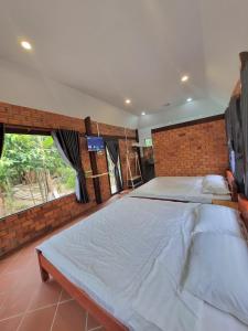 Postel nebo postele na pokoji v ubytování Homestay Nam Hàm Luông