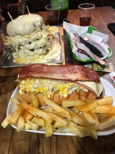 a plate of food with a sandwich and french fries at Casa Puente de Boyaca in Tunja