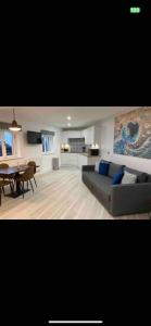 a living room with a couch and a table at The Captains Wheel and Anchor in Skerries