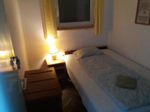 Posteľ alebo postele v izbe v ubytovaní Badacsonyi Lugas apartmanok