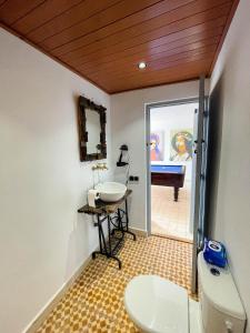 a bathroom with a sink and a toilet and a tub at Taouarguit Guest House in Imsouane +104 photos