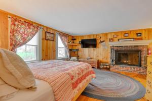 a bedroom with a bed and a fireplace at James Place Inn Bed and Breakfast in Freeport