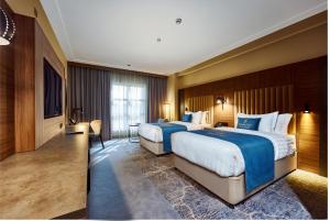 Postel nebo postele na pokoji v ubytování Paradise Nice Hotel Jeddah