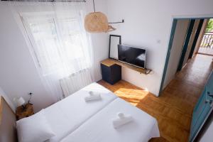 A bed or beds in a room at Late Story