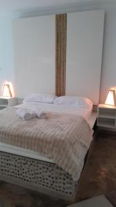 a bedroom with two beds with towels on them at Noah Housing in Santo Tomé +10 photos
