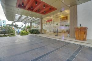 a lobby of a building with a glass door at Palette - Hotel chennai le palace in Chennai