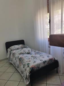Postel nebo postele na pokoji v ubytování Appartamento Golfo dei Poeti