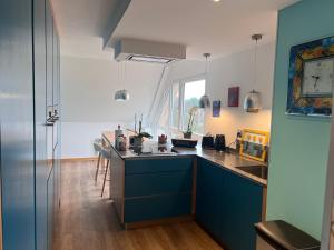 Kuchyň nebo kuchyňský kout v ubytování Duplex de caractère - 200m2