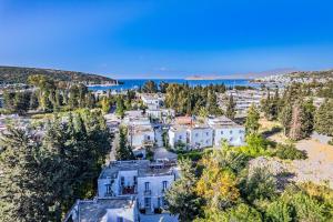 an aerial view of a town with white houses at Paloma Family Club in Bitez