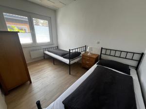 Postel nebo postele na pokoji v ubytování Ferienhaus Maite