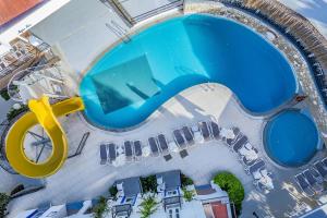 an overhead view of a swimming pool with a pool slide at Paloma Family Club in Bitez