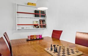 a chess board on a table in a room at Gorgeous Apartment In Nørre Asmindrup in Nørre Asmindrup