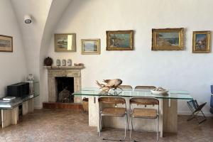 a bird sitting on a glass table in a room at Captain House Luxury House in Piazzetta in Capri
