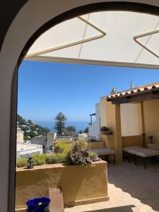 a view of a balcony with a view of a city at Captain House Luxury House in Piazzetta in Capri