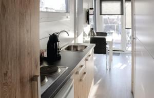 a kitchen with a sink and a counter top at Fortaleza in Hellevoetsluis
