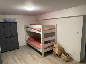 a small room with two bunk beds in it at Les Mariniers A Sens in Sens