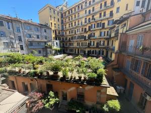 a bunch of potted plants on the roof of a building at Marghera Botanical - Intero appartamento 50m2 in Milan