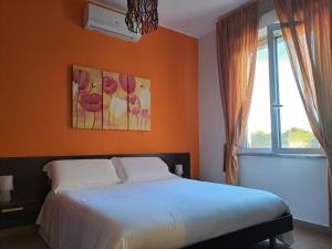 A bed or beds in a room at B&B Domu Mea