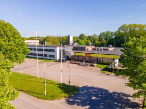 an empty parking lot in front of a building at Halmstad Hotel Apartments in Halmstad