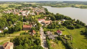an aerial view of a small town next to a lake at Apartament Moje Dąbrówno in Dąbrówno
