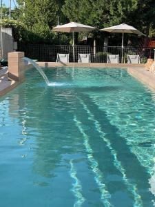 The swimming pool at or close to Corinthian Village