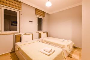 Ένα ή περισσότερα κρεβάτια σε δωμάτιο στο Villa Patara 1 +29 φωτογραφίες