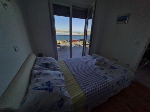 Postel nebo postele na pokoji v ubytování Apartmani Ždrijac Nin