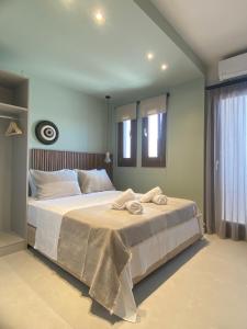 Postel nebo postele na pokoji v ubytování Αura Luxury Apartments