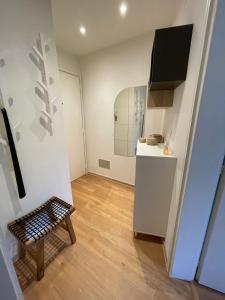 a small kitchen with a table and a bench in a room at Appartamento La Torretta in Locarno