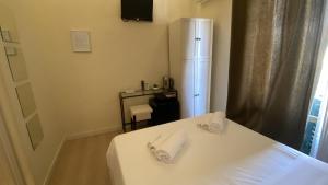 Postel nebo postele na pokoji v ubytování Reggio Centro B&B