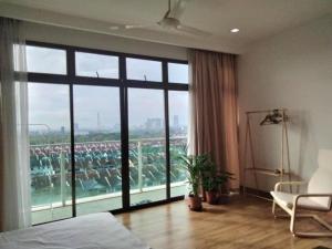 a bedroom with a bed and a large window at 03 Palazio Apartment Japanese style Studio Mount Austin Wifi & Netflix in Johor Bahru +20 photos