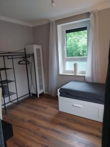 Ένα ή περισσότερα κρεβάτια σε δωμάτιο στο Bad Aibling City Apartment Zimmer