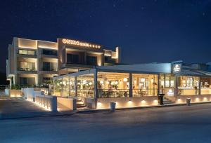 a building with lights in front of it at night at Oniro Boutique Hotel in Toroni