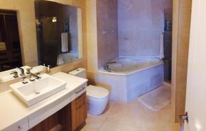 a bathroom with a sink and a tub and a toilet at 06F Resort Breathtaking Ocean Views Panama Canal in Panama City