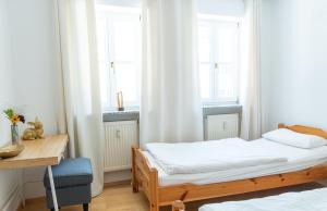 Postel nebo postele na pokoji v ubytování Ferienwohnungen hinter der Residenz