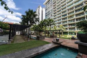 a courtyard with a pool in front of a building at 03 Palazio Apartment Japanese style Studio Mount Austin Wifi & Netflix in Johor Bahru