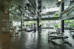 a gym with a bunch of exercise equipment in a room at 03 Palazio Apartment Japanese style Studio Mount Austin Wifi & Netflix in Johor Bahru