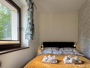 Łóżko lub łóżka w pokoju w obiekcie Apartamenty Komarno 46 Jacuzzi&Sauna