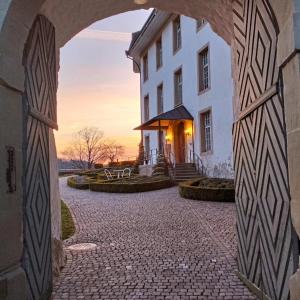 a building with an archway in front of a building at BnB SchlafSchloss in Sumiswald