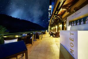 a restaurant with a view of the stars at Retro Riverside Wellness Resort in Karlovy Vary