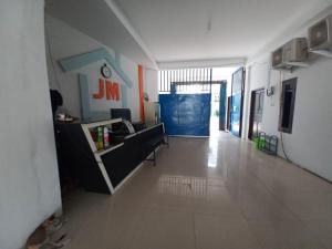 an empty hallway of an office with a room at Hotel O Jm Guest House 2NearStasiun karawang in Pundong