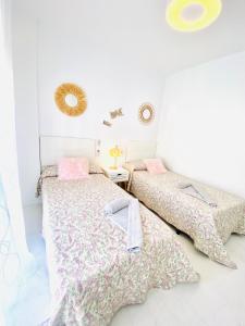 Ένα ή περισσότερα κρεβάτια σε δωμάτιο στο Jardines de Adnania en Marina del Este con vistas al mar +32 φωτογραφίες