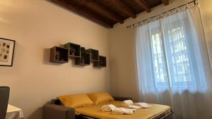 a room with a table and a large window at Marghera Botanical - Intero appartamento 50m2 in Milan +26 photos