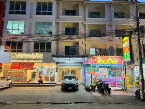 a car parked in front of a building at JS786 Cafe&Bistro in Pattaya