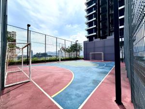 a basketball court with a basketball hoop on a building at Hakuna Matata Apartment Urban Suites Jelutong in Jelutong