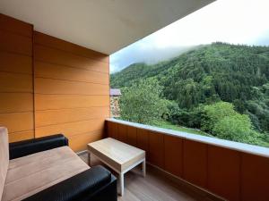 a room with a view of a mountain at Aygün Home Apart in Çaykara